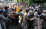 Protesters and All India Students' Association (AISA) supporters scuffle with police personnel during a demonstration against India's Chief Election Commissioner Gyanesh Kumar in New Delhi on October 3, 2026, to demand his resignation over alleged irregularities in the Special Intensive Revision (SIR) of electoral rolls. (Photo by Arun SANKAR / AFP)