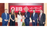 QIIB COO Mohammed Khair Barhoumeh receiving the award from Citibank Head of Financial Institutions Sales for the Middle East Seemanti Considine in presence of other officials.