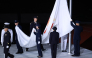 Members of the Japan Self-Defense Forces lower the Olympic Council of Asia (OCA) flag during the closing ceremony of the 2026 Asian Games at Nagoya City Mizuho Park Athletic Stadium in Nagoya, Aichi Prefecture on October 4, 2026. (Photo by David Gray / AFP)