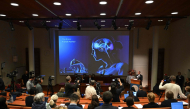 Karolinska Institute neuroscience professor Abdel El Manira speaks in front of a screen displaying an illustration of the human brain during the announcement of the winners of the 2026 Nobel Prize in Physiology or Medicine at the Karolinska Institute in Stockholm, Sweden, on October 5, 2026. (Photo by Jonathan Nackstrand / AFP)