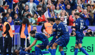 France’s Michael Olise (left) celebrates scoring his team’s fourth goal with teammates. 