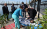 An injured crew member from a ship struck by drones in Bulgaria's exclusive economic zone is moved on a stretcher after he was rescued, at the Varna harbour on October 6, 2026.  (Photo by AFP)
 