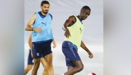 Al Duhail's Almoez Ali (right) and Sultan Al-Brake during a training session yesterday.