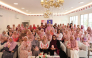 Participants and experts pose for a group photo at the awareness session. 