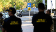 Police officers guard outside the scene of a knife attack at a vocational school in the town of Ostroleka, Poland. (Photo by Mladen ANTONOV / AFP)