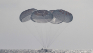 This picture provided by NASA shows the SpaceX Crew Dragon Freedom spacecraft as it lands with NASA astronauts Jessica Meir, Jack Hathaway, ESA (European Space Agency) astronaut Sophie Adenot, and Roscosmos cosmonaut Andrey Fedyaev aboard in the Pacific Ocean off the coast of Los Angeles, California, on October 8, 2026. Photo by Keegan Barber / NASA / AFP