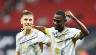 Al Duhail's Krzysztof Piatek (left) and Almoez Ali celebrate.
