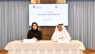 QC Board Member Dr. Khalid bin Klefeekh Al Hajri, and on behalf of the Workers’ Support and Insurance Fund Executive Director Kholoud Saif Al Kubaisi during the signing of the agreement. 
