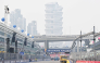 Air pollution is seen across the skyline as people prepare the street circuit before the Formula One Singapore Grand Prix night race.