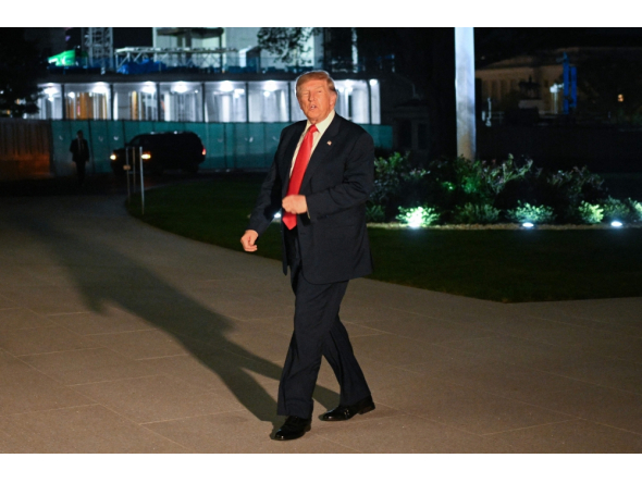 US President Donald Trump speaks with the media after arriving on Marine One on the South Lawn of the White House in Washington, DC on October 9, 2026. (Photo by Alex Wroblewski / AFP)
 