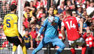 Leeds United's English goalkeeper #01 James Trafford (C) comes out of his box to vie with Arsenal's Swedish striker #14 Viktor Gyokeres during the English Premier League football match between Arsenal and Leeds United at the Emirates Stadium in London on October 10, 2026. (Photo by Adrian Dennis / AFP) 