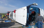 This handout photograph taken and released on October 11, 2026 by Turkish news agency DHA (Demiroren News Agency) shows fire department and first aid officials operating at the site of a crashed bus following the collision of a tour bus and a lorry in Manisa, west of Turkiye.  Photo by Handout / DHA (Demiroren News Agency) / AFP