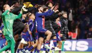 PSG’s Khvicha Kvaratskhelia (centre) celebrates team’s victory over Le Mans FC with teammates on Saturday. (AFP)