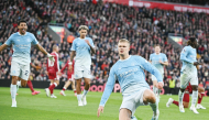 Manchester City’s Erling Haaland (right) celebrates after scoring the opening goal.