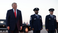 US President Donald Trump talks with members of the media after landing at Youngstown Air Reserve Station on October 12, 2026 in Vienna, Ohio. Alex Wong/Getty Images/AFP