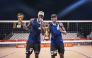 Qatar's Cherif Younousse (left) and Ahmed Tijan celebrate with their trophies.
