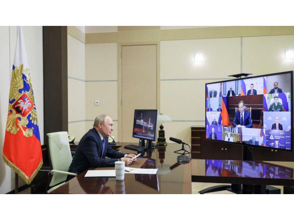 In this pool photograph distributed by the Russian state agency Sputnik, Russia's President Vladimir Putin chairs a meeting on cybersecurity with government and business members via videolink at the Novo-Ogaryovo residence outside Moscow on October 14, 2026. (Photo by Mikhail METZEL / POOL / AFP)
