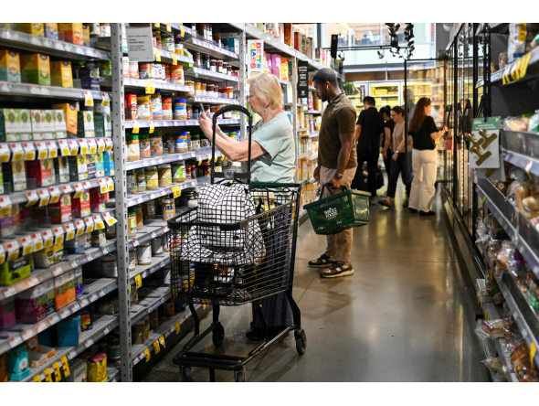 People shop for groceries at a supermarket in Manhattan on August 25, 2026 in New York City. US consumer inflation climbed more than anticipated in September, government data showed October 14, 2026, as the US war with Iran pushed energy costs higher, deepening strains on American households ahead of next month's midterm elections. The consumer price index (CPI) was slightly hotter than analysts expected, rising to 3.7 percent on a year-on-year basis, said the Department of Labor. This was an acceleration from 3.4 percent in August. (Photo by ANGELA WEISS / AFP)
