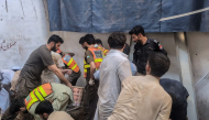 This photograph taken and released by the Khyber Pakhtunkhwa province's Emergency Service (Rescue 1122) on October 15, 2026 shows rescue workers during a search operation after a roof collapsed at a school in Peshawar. (Photo by Handout / Khyber Pakhtunkhwa province's Emergency Service (Rescue 1122) / AFP)