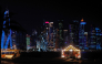 The Corniche promenade facing the skyline of illuminated high-rise buildings is pictured in Doha on October 11, 2026. (Photo by KARIM JAAFAR / AFP)
