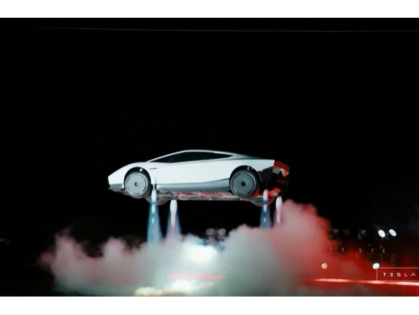 A grab taken on October 16, 2026 from a live feed released by Tesla shows the company unveiling on October 15 its next-generation Roadster electric car in McGregor, Texas, United States. (Photo by Tesla / AFP)