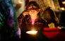 Community members grieve during a candlelight vigil at Peace Corner on October 16, 2026 in Bend, Oregon. Mathieu Lewis-Rolland/Getty Images/AFP