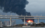 Smoke rises above the city following an air attack on the oil terminal in Saint Petersburg on October 18, 2026, amid the ongoing Russian-Ukrainian conflict. (Photo by AFP)