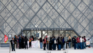 Protesters, including students from the Ecole du Louvre, block the entrance to the Louvre Museum in Paris on October 19, 2026. (Photo by Dimitar Dilkoff / AFP)
