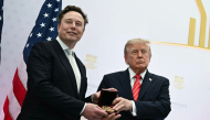 (Files) US President Donald Trump presents the National Medal of Science to Elon Musk during the 