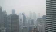High-rise buildings are seen in Kuala Lumpur on October 20, 2026, as Malaysia continues to be shrouded in haze caused by fires in Indonesia. (Photo by Mohd Rasfan / AFP)