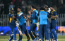 Sri Lanka's players celebrate after their victory in the one-day international (ODI) tri-series cricket match between England and Sri Lanka at the Rawalpindi Cricket Stadium in Rawalpindi on October 22, 2026. (Photo by FAROOQ NAEEM / AFP)