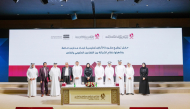 Minister of Education and Higher Education H E Lolwah bint Rashid Al Khater, Minister of Commerce and Industry H E Sheikh Faisal bin Thani bin Faisal Al Thani, and other officials during signing ceremony.