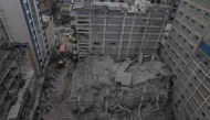 This aerial view shows personell from the Kenya Defence Forces Disaster Response Battalion inspecting the rubble of a collapsed residential building that was still under construction in the Eastleigh neighborhood of Nairobi on October 23,2026. Photo by Tony Karumba / AFP