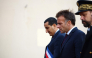 French President Emmanuel Macron (C) walks with Mayor of Trappes Ali Rabeh (L) during a visit following a shooting in Trappes, near Paris on October 23, 2026. (Photo by Hannah McKay / POOL / AFP)