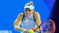 Kazakhstan's Elena Rybakina hits a return to Russia's Diana Shnaider during their women's singles semifinal match on October 24, 2026. (Photo by CN-STR / AFP)