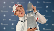 Yuri Yoshida poses with the trophy.