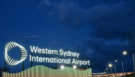 A view of signage at the newly-opened Western Sydney International Airport in Sydney on October 26, 2026. (Photo by Saeed Khan / AFP)