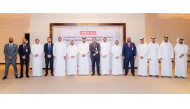 Chief of Compliance and Anti Financial Crimes at QIIB Mohammad Rifaie with other officials during the event.