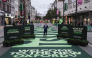 London Mayor Sadiq Khan (C) attends the opening ceremony for a section of Oxford Street, as it goes permanently traffic-free for the first time in central London on October 26, 2026. (Photo by Carlos Jasso / AFP)