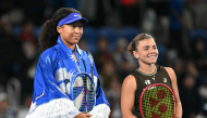 Japan's Naomi Osaka (L) and Italy's Jasmine Paolini pose for photos ahead of match on October 27, 2026. (Photo by Andrew Caballero-Reynolds / AFP)