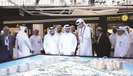 Minister of Municipality H E Abdullah bin Hamad bin Abdullah Al-Attiyah, Minister of Finance H E Ali bin Ahmed Al-Kuwari with other dignitaries touring one of the exhibition pavilions yesterday.