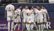 Al Shamal players celebrate a goal againstAl Hilal.