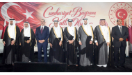Minister of Awqaf and Islamic Affairs H E Ghanem bin Shaheen bin Ghanem Al Ghanim (second left), Minister of Municipality H E Abdullah bin Hamad bin Abdullah Al Attiyah (first left) Ambassador of Türkiye to Qatar H E Yakup Caymazoğlu (third left) and Their Excellencies the Ministers and officials at the Turkish National Day reception in Doha yesterday.