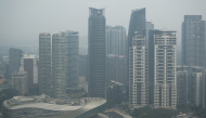 High-rise buildings are seen in Kuala Lumpur on October 20, 2026, as Malaysia continues to be shrouded in haze. (Photo by Mohd Rasfan / AFP)