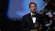 England and Bayern Munich forward Harry Kane reacts after receiving the Ballon d'Or award for the best male footballer during the 2026 Ballon d'Or France Football award ceremony at the Palladium Theatre in London on October 26, 2026. (Photo by FRANCK FIFE / AFP)