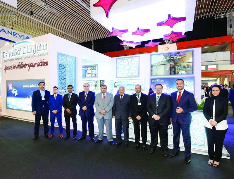 Es’hailSat officials at their booth at the exhibition.