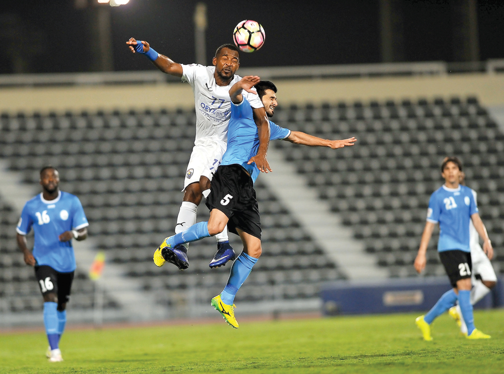 Al Wakrah’s Waheed Mohamed Tahiri (right) vies for the ball against Al Kharaitiyat’s Abdul Rahim Al Meamari during their Qatar Stars League football match at Al Wakrah Stadium yesterday. Picture by: Abdul Basit/The Peninsula