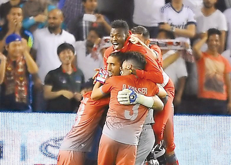 Lekhwiya players celebrate after the penalty shoot-out which ensured their victory against Al Sadd in the Emir Cup final played at Jassim Bin Hamad Stadium in this file photo.