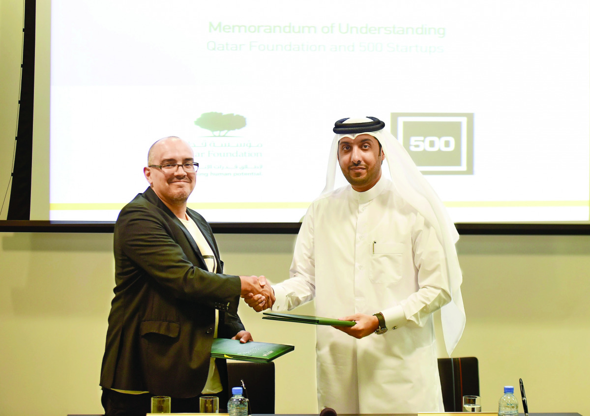 Dave McClure (left), Founding Partner, 500 Startups, and Dr Hamad Al Ibrahim, Executive Vice-President, QF R&D, and Chairman, Board of Directors, QSTP, exchanging documents after signing the MoU.