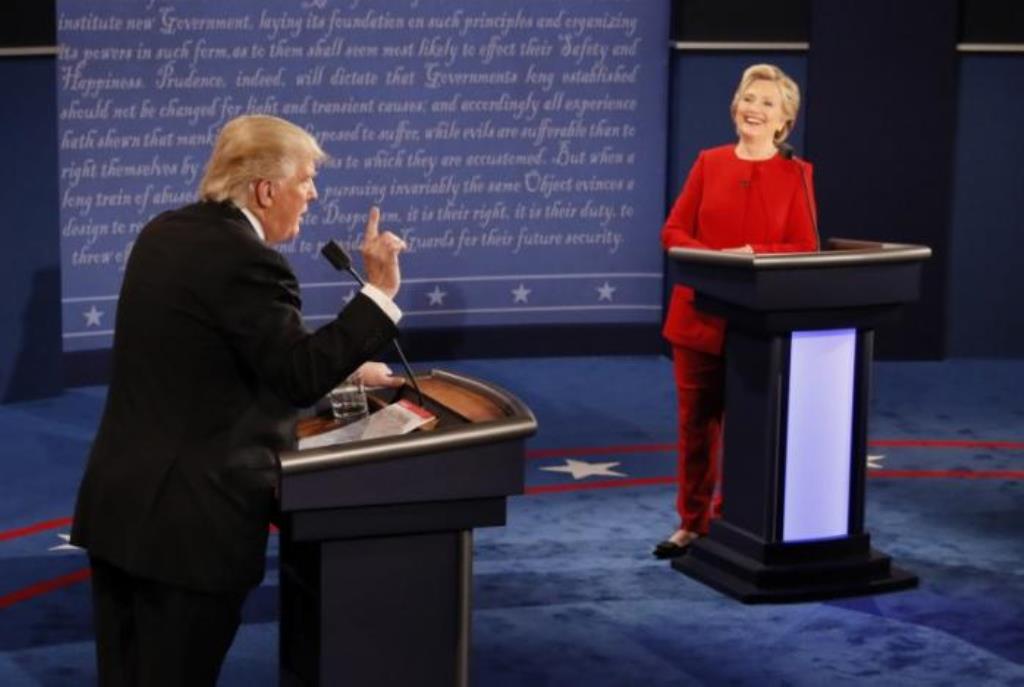 Donald Trump speaks as Democratic U.S. presidential nominee Hillary Clinton listens during their first presidential debate at Hofstra University in Hempstead, New York. (Reuters/Rick Wilking)